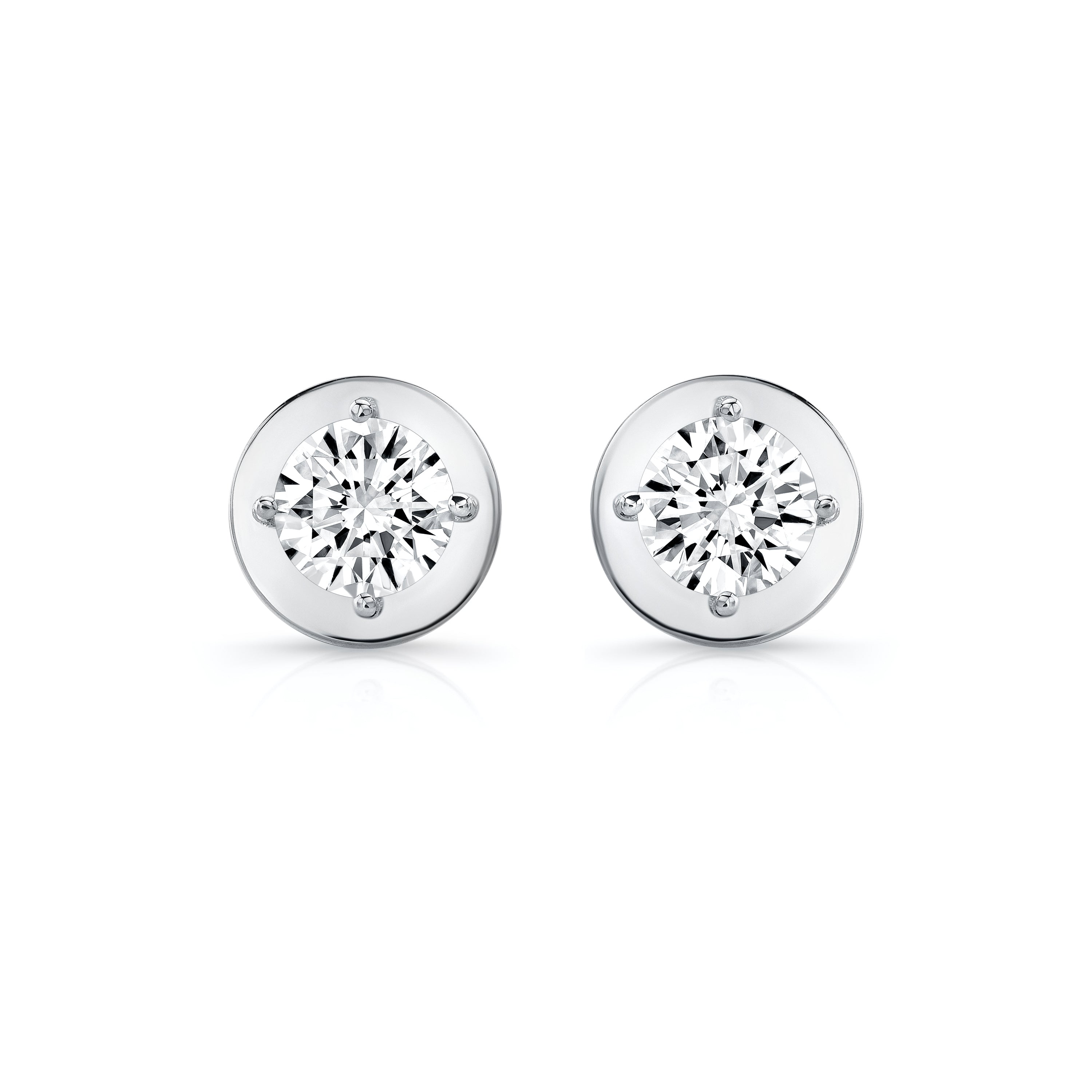 Pair of diamond stud earrings on a white background