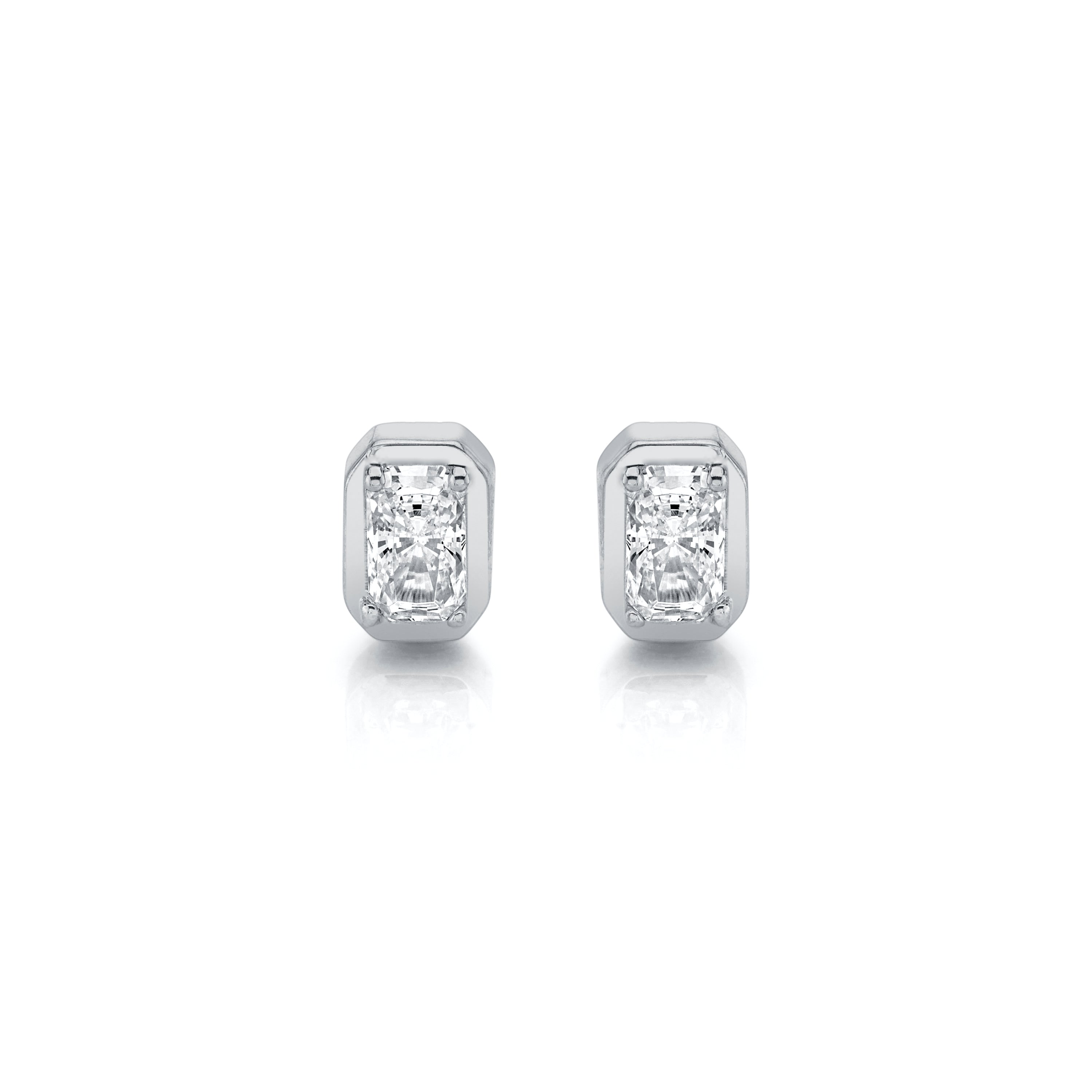Pair of diamond stud earrings on a white background