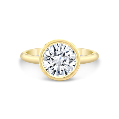 round diamond engagement ring bezel set in 14k yellow gold