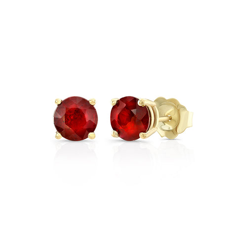 round ruby studs in yellow gold
