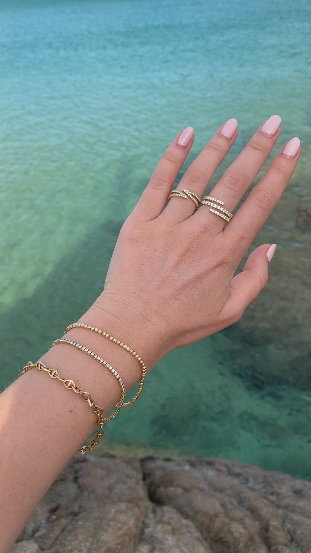 14kgold chunky diamond wrap ring worn on a hand on the italian coast