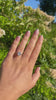 video of woman wearing a radiant cut solitaire engagement ring