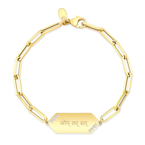 14k gold ID bracelet with the engraving Aum Tat Sat